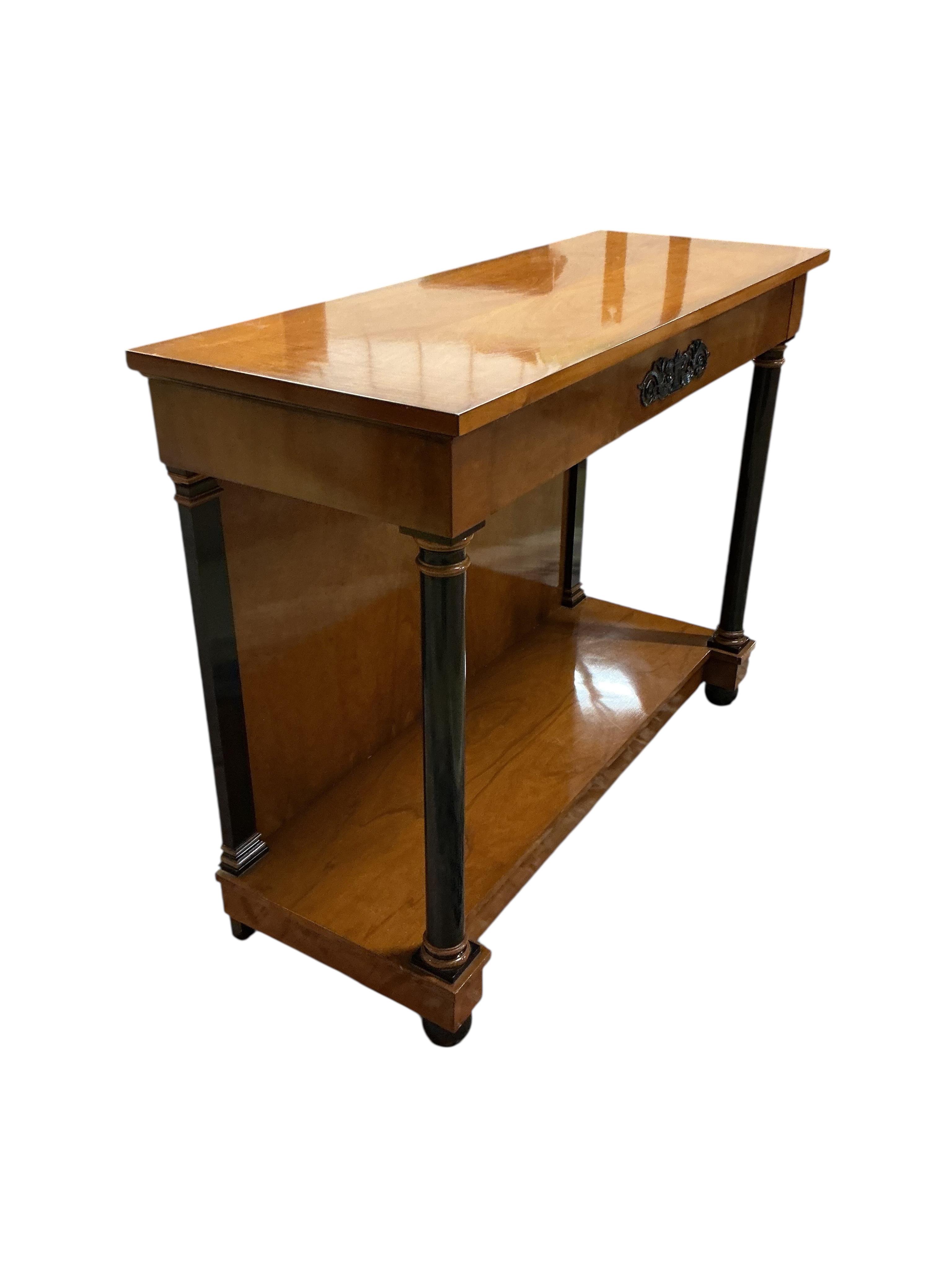 A pair of Biedermeier style cherry two tier console tables, with frieze drawers, width 110cm, depth 42cm, height 86cm